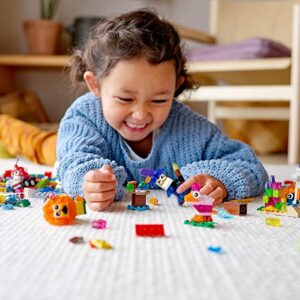 child playing Legos, building bricks